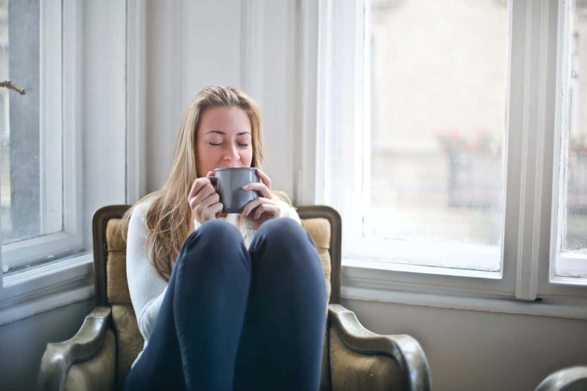 woman drinking coffee- how to stop worrying about what people think of you