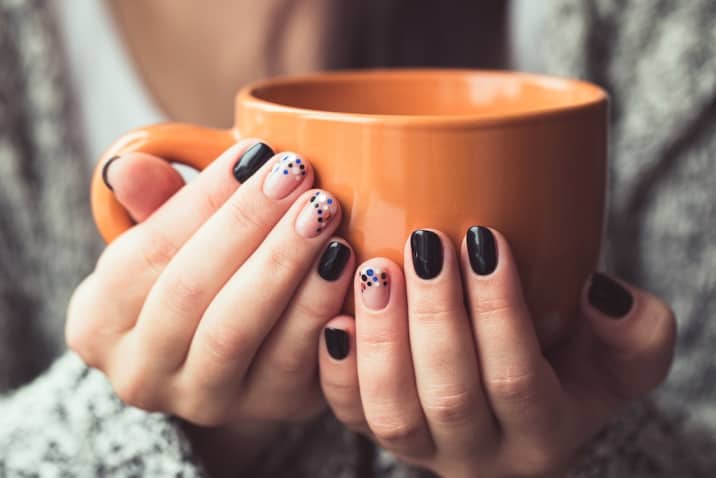 manicured nails and a coffee mug - productive sunday habits