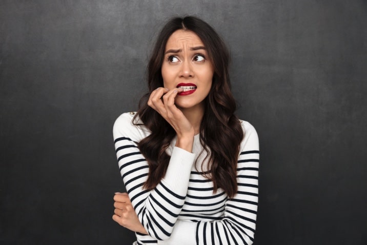 woman biting nails- how to break bad habits