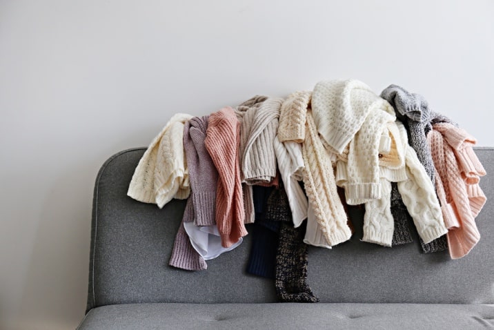 clothes cluttered on sofa- toxic thing to remove from life-clutter