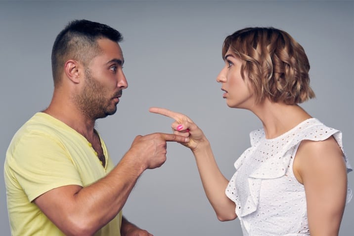 man and woman pointing at each other-toxic thing to remove from life- victim mentality