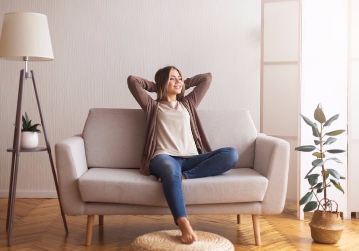 A woman relaxing on a couch
