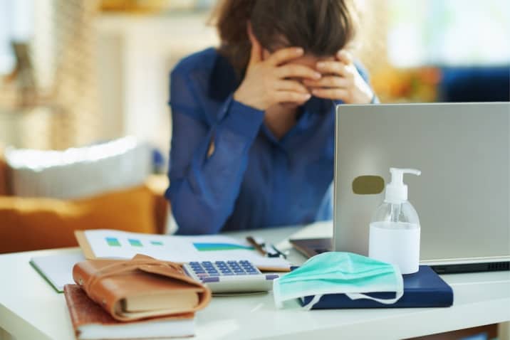 a stressed woman sitting in office