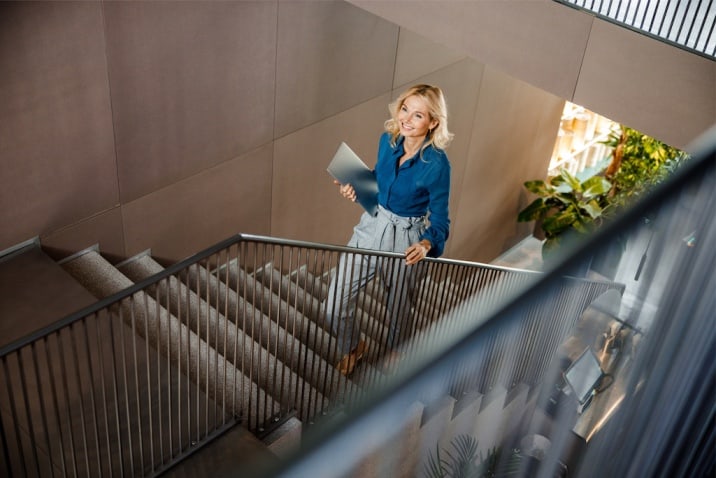 a woman climbing stairs - how to stop being a couch potato